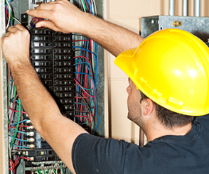 Residential Electrician Working on Breaker Box in in Palm Beach Gardens, Jupiter, West Palm Beach, Lake Worth, Wellington, and Stuart